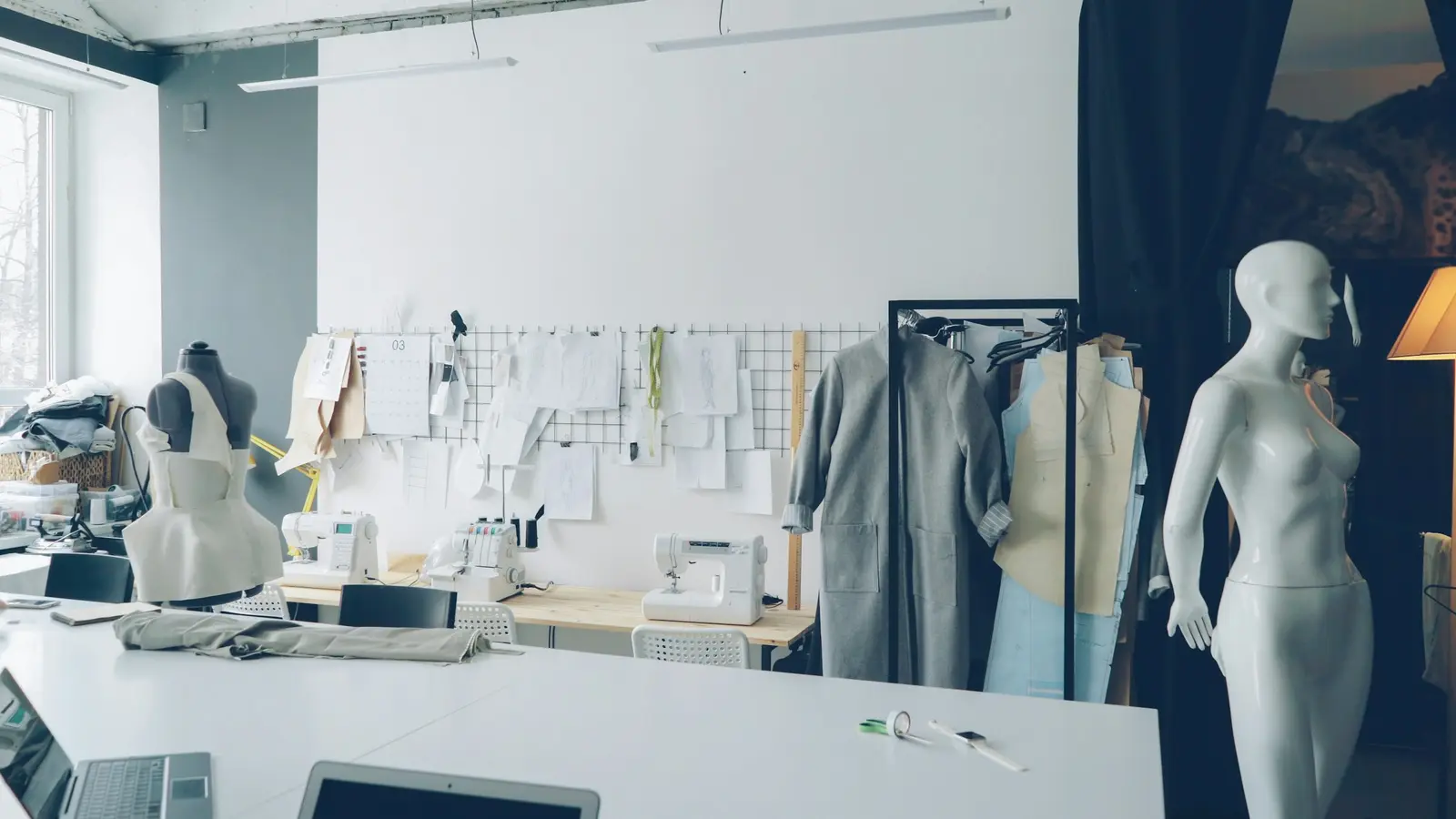 A fashion studio with garments on rails
